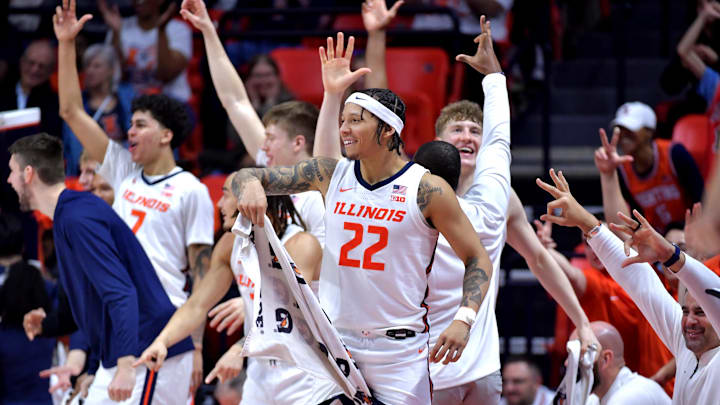 Dec 29, 2024; Champaign, Illinois, USA;  Illinois Fighting Illini players celebrate teammate  Kylan Boswell (4) after he recorded a triple double in a 117-64 win over the Chicago State Cougars at State Farm Center. Mandatory Credit: Ron Johnson-Imagn Images