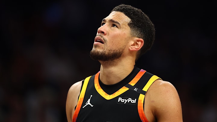 Apr 9, 2025; Phoenix, Arizona, USA; Phoenix Suns guard Devin Booker (1) reacts after a play against the Oklahoma City Thunder during the first half at Footprint Center. Mandatory Credit: Mark J. Rebilas-Imagn Images