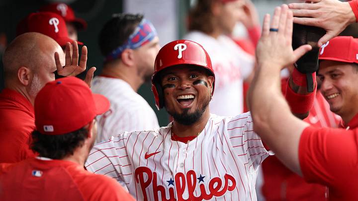 Philadelphia, Pennsylvania, USA; Philadelphia Phillies second baseman Luis Arraez (4) reacts in the dugout after scoring against the Washington Nationals during the third inning at Citizens Bank Park. Mandatory Credit: Bill Streicher-Imagn Images