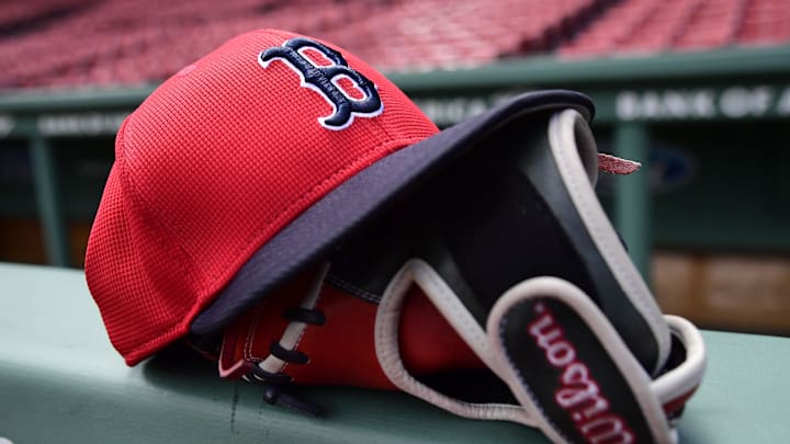 May 18, 2025; Boston, Massachusetts, USA; A Boston Red Sox hat and glove rests on the railing by the dugout prior to a game against the Atlanta Braves at Fenway Park. Mandatory Credit: Bob DeChiara-Imagn Images May 18, 2025; Boston, Massachusetts, USA; A Boston Red Sox hat and glove rests on the railing by the dugout prior to a game against the Atlanta Braves at Fenway Park. Mandatory Credit: Bob DeChiara-Imagn Images
