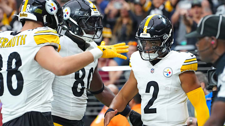 Oct 13, 2024; Paradise, Nevada, USA; Pittsburgh Steelers quarterback Justin Fields (2) celebrates with team mates after scoring a rushing touchdown against the Las Vegas Raiders during the second quarter at Allegiant Stadium. Mandatory Credit: Stephen R. Sylvanie-Imagn Images