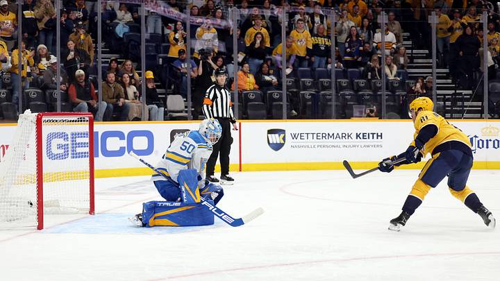 Oct 17, 2026; Nashville, Tennessee, USA;  Nashville Predators center Jonathan Marchessault (81) scores off a penalty shot against St. Louis Blues goaltender Jordan Binnington (50) during the first period at Bridgestone Arena.  Mandatory Credit: Alan Poizner-Imagn Images