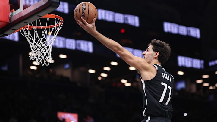 Dec 6, 2025; Brooklyn, New York, USA; Brooklyn Nets guard Ben Saraf (77) goes to the basket during the second half against the New Orleans Pelicans at Barclays Center. Mandatory Credit: Vincent Carchietta-Imagn Images Dec 6, 2025; Brooklyn, New York, USA; Brooklyn Nets guard Ben Saraf (77) goes to the basket during the second half against the New Orleans Pelicans at Barclays Center. Mandatory Credit: Vincent Carchietta-Imagn Images
