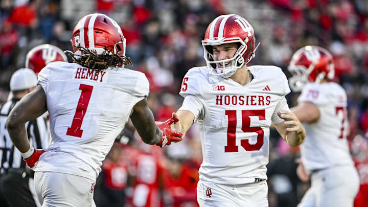 Nov 1, 2025; College Park, Maryland, USA;  Indiana Hoosiers quarterback Fernando Mendoza (15) celebrates with  running back Roman Hemby (1) after scoring a touchdown during the second half against the Maryland Terrapins at SECU Stadium. Mandatory Credit: Tommy Gilligan-Imagn Images