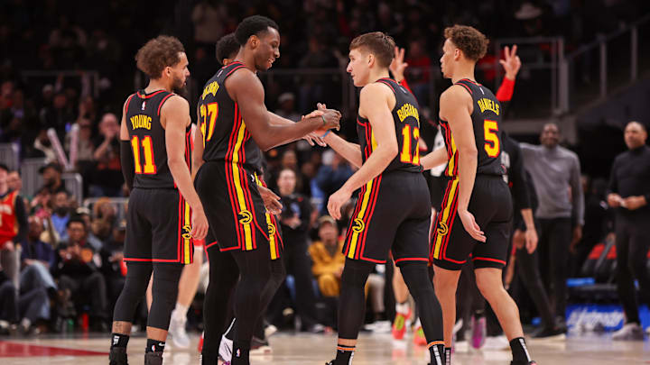 Jan 23, 2025; Atlanta, Georgia, USA; Atlanta Hawks forward Onyeka Okongwu (17) congratulates guard Bogdan Bogdanovic (13) after a basket against the Toronto Raptors in the fourth quarter at State Farm Arena. Mandatory Credit: Brett Davis-Imagn Images
