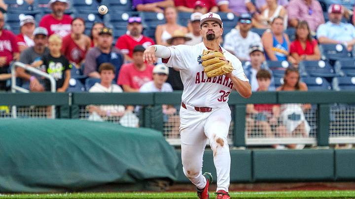 Jun 13, 2026; Omaha, NE, USA; Alabama Crimson Tide third baseman Jason Torres (32) throws for an out against the Oklahoma Sooners during the ninth inning at Charles Schwab Field. Jun 13, 2026; Omaha, NE, USA; Alabama Crimson Tide third baseman Jason Torres (32) throws for an out against the Oklahoma Sooners during the ninth inning at Charles Schwab Field.