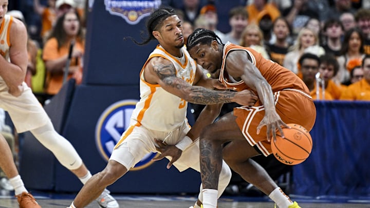 Mar 14, 2025; Nashville, TN, USA; Tennessee Volunteers guard Bishop Boswell (3) pokes the ball from Texas Longhorns guard Tramon Mark (12) during the second half at Bridgestone Arena. Mandatory Credit: Steve Roberts-Imagn Images Mar 14, 2025; Nashville, TN, USA; Tennessee Volunteers guard Bishop Boswell (3) pokes the ball from Texas Longhorns guard Tramon Mark (12) during the second half at Bridgestone Arena. Mandatory Credit: Steve Roberts-Imagn Images