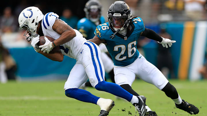 Indianapolis Colts wide receiver Josh Downs (1) is tackled by Jacksonville Jaguars safety Antonio Johnson (26) during the second quarter of an NFL football matchup Sunday, Oct. 6, 2024 at EverBank Stadium in Jacksonville, Fla. The Jaguars edged the Colts on a field goal 37-34. [Corey Perrine/Florida Times-Union]