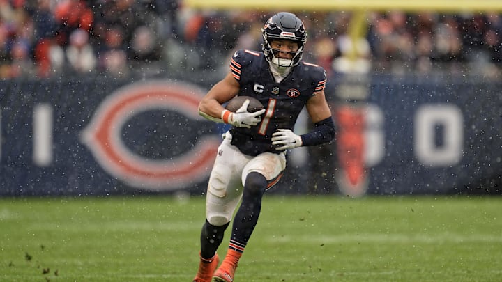 Dec 31, 2023; Chicago, Illinois, USA;  Chicago Bears quarterback Justin Fields (1) runs with the