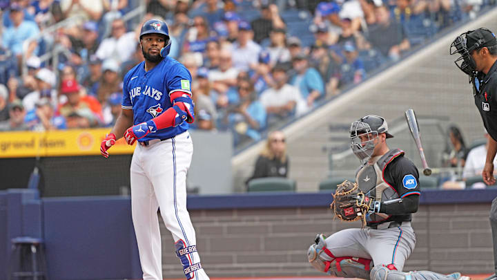 Toronto Blue Jays designated hitter Vladimir Guerrero Jr. (27) flips his bat after being walked against the Miami Marlins during the first inning at Rogers Centre.