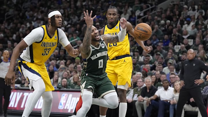 Apr 25, 2025; Milwaukee, Wisconsin, USA; Milwaukee Bucks guard Damian Lillard (0) drives to the basket gains Indiana Pacers center Myles Turner (33) and forward Aaron Nesmith (23) in the second half during game three of first round for the 2024 NBA Playoffs at Fiserv Forum. Mandatory Credit: Michael McLoone-Imagn Images Apr 25, 2025; Milwaukee, Wisconsin, USA; Milwaukee Bucks guard Damian Lillard (0) drives to the basket gains Indiana Pacers center Myles Turner (33) and forward Aaron Nesmith (23) in the second half during game three of first round for the 2024 NBA Playoffs at Fiserv Forum. Mandatory Credit: Michael McLoone-Imagn Images
