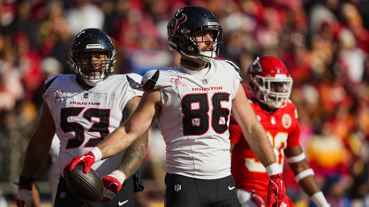 Dec 21, 2024; Kansas City, Missouri, USA; Houston Texans tight end Dalton Schultz (86) reacts after scoring a touchdown during the first half against the Kansas City Chiefs at GEHA Field at Arrowhead Stadium.