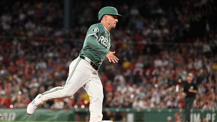 May 16, 2025; Boston, Massachusetts, USA; Boston Red Sox third base Alex Bregman (2) scores on a RBI single by shortstop Trevor Story (not pictured) during the ninth inning against the Atlanta Braves at Fenway Park. Mandatory Credit: Eric Canha-Imagn Images