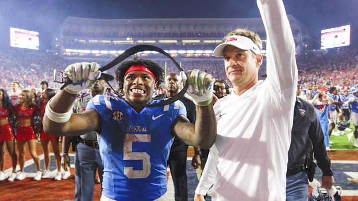Nov 15, 2025; Oxford, Mississippi, USA; Mississippi Rebels running back Kewan Lacy (5) and head coach Lane Kiffin react after defeating the Florida Gators at Vaught-Hemingway Stadium. Mandatory Credit: Petre Thomas-Imagn Images