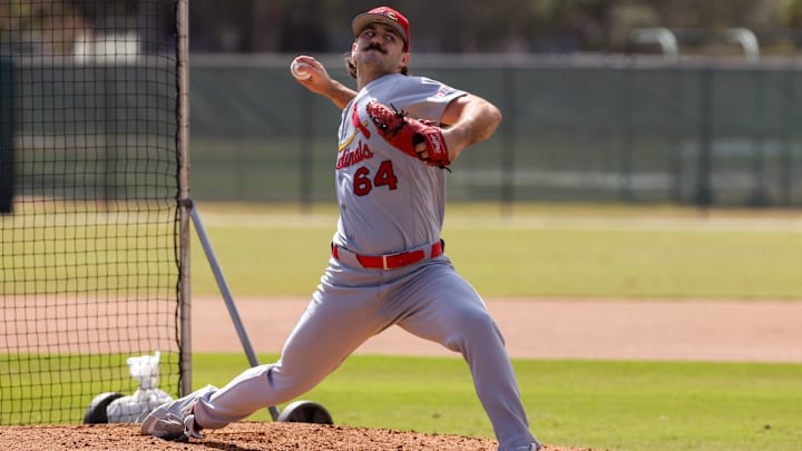 Feb 14, 2026; Jupiter, FL, USA; St. Louis Cardinals pitcher Ryan Fernandez (64) delivers a pitch during a spring training workout at Roger Dean Chevrolet Stadium. Mandatory Credit: Sam Navarro-Imagn Images