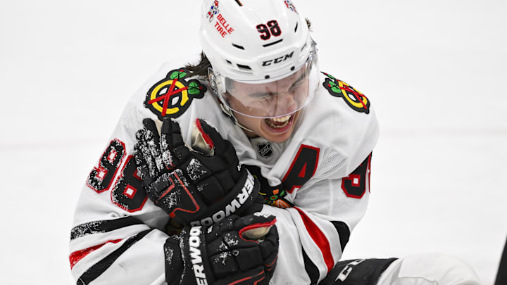 Dec 12, 2025; St. Louis, Missouri, USA; Chicago Blackhawks center Connor Bedard (98) reacts in pain after a face off against St. Louis Blues center Brayden Schenn (not pictured) during the third period at Enterprise Center. Mandatory Credit: Jeff Curry-Imagn Images