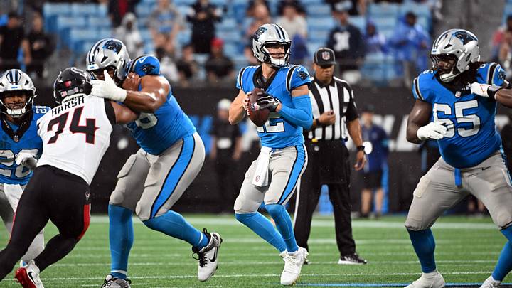 Carolina Panthers quarterback Kenny Pickett (12) looks to pass during the first half Carolina Panthers quarterback Kenny Pickett (12) looks to pass during the first half