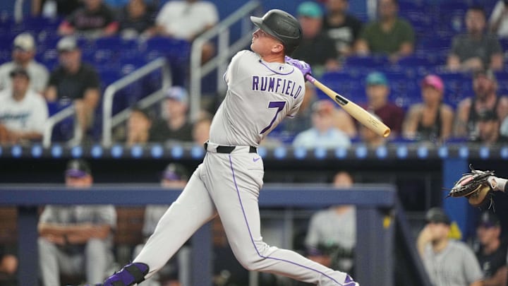 Colorado Rockies first baseman TJ Rumfield (7) hits home run in the second inning against the Miami Marlins at loanDepot Park. 