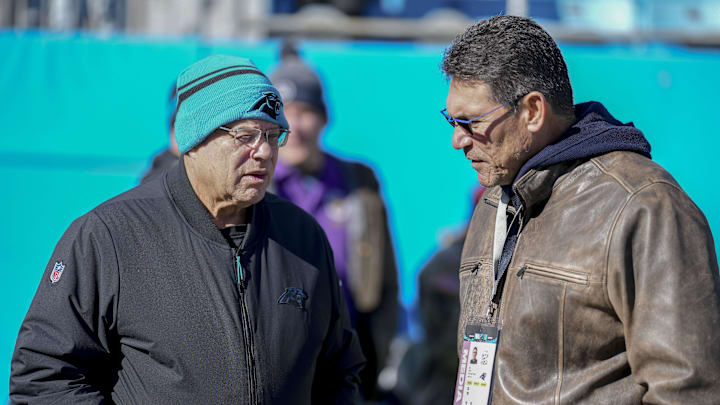 Dec 22, 2024; Charlotte, North Carolina, USA; Panthers owner David Tepper talks with former Panthers head coach Ron Rivera during pregame warmups at Bank of America Stadium. Mandatory Credit: Jim Dedmon-Imagn Images Dec 22, 2024; Charlotte, North Carolina, USA; Panthers owner David Tepper talks with former Panthers head coach Ron Rivera during pregame warmups at Bank of America Stadium. Mandatory Credit: Jim Dedmon-Imagn Images
