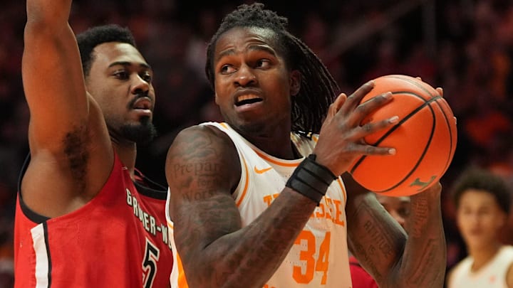 Tennessee forward Felix Okpara (34) tries to get around Gardner-Webb forward Jacob Hogarth (5) in an NCAA college basketball game on Dec. 21, 2025, in Knoxville, Tennessee.