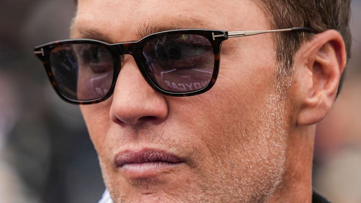Tom Brady waits to climb into the two seater car Sunday, May 25, 2025, ahead of the 109th running of the Indianapolis 500 at Indianapolis Motor Speedway.