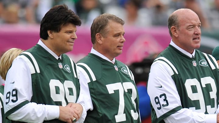 Oct 13, 2013; East Rutherford, NJ, USA; New York Jets former players Mark Gastineau (99) and Joe Klecko (73) and Marty Lyons serve as honorary captains during the coin toss before the New York Jets faced the Pittsburgh Steelers at MetLife Stadium. The Steelers won the game 19-6. 