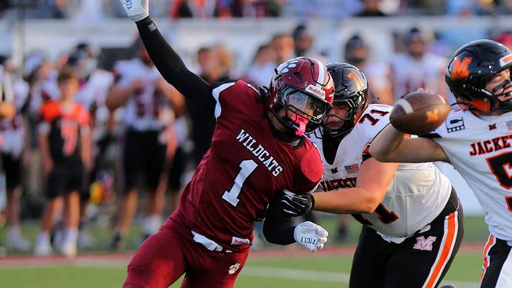 Newark's Roy Price Jr. pressures Mount Vernon's Mason Richards during the Wildcats' 24-7 home loss at White Field on Aug. 29, 2025.