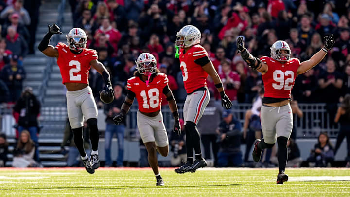 Ohio State Buckeyes defensive back Caleb Downs (2) celebrates with safety Jaylen McClain (18), linebacker Sonny Styles (0) and defensive end Caden Curry (92) after Downs intercepted a pass in the second half at Ohio Stadium on Saturday, Nov. 1, 2025 in Columbus, Ohio.
