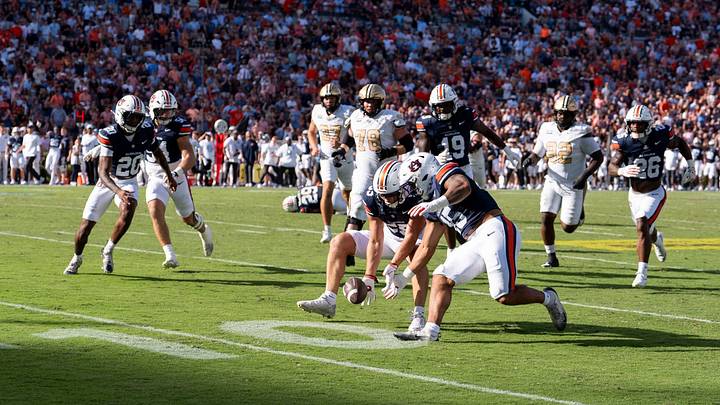 Auburn Tigers defensive back Cade Carlson (55) scoops a block punt and runs it back for a touchdown as Auburn Tigers take on Vanderbilt Commodores at Jordan-Hare Stadium in Auburn, Ala. on Saturday, Sept. 26, 2026. Auburn Tigers lead Vanderbilt Commodores 14-3 at halftime. Auburn Tigers defensive back Cade Carlson (55) scoops a block punt and runs it back for a touchdown as Auburn Tigers take on Vanderbilt Commodores at Jordan-Hare Stadium in Auburn, Ala. on Saturday, Sept. 26, 2026. Auburn Tigers lead Vanderbilt Commodores 14-3 at halftime.