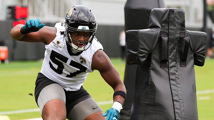 Jaguars defensive end Bryan Thomas Jr. (57) runs a drill with center Robert Hainsey (73) during the Jaguars’ fourth OTA of the year, Monday June 1, 2026 at the Miller Electric Center in Jacksonville, Fla. [Doug Engle/Florida Times-Union]