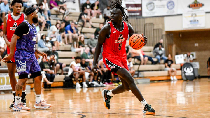 Michigan State freshman and Team Goodfellas' Kur Teng, moves the ball against Team Case Credit Union in the game on Tuesday, June 25, 2024, during the Moneyball Pro-Am at Holt High School.