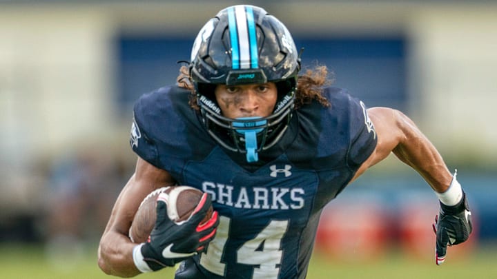 Spanish River Blake Wallace runs the ball against Seminole Ridge on August 30, 2024 in Boca Raton, Florida.