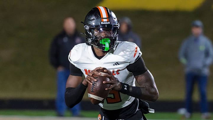 Belleville's Bryce Underwood rolls out to pass during a loss to Howell Friday, Oct. 25, 2024.