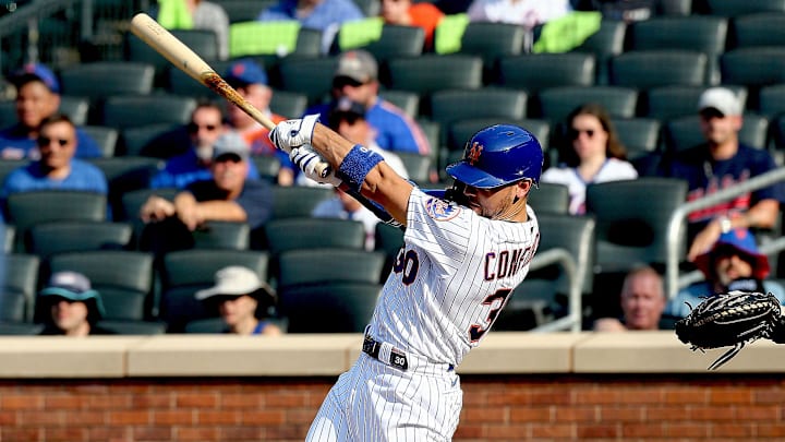 Aug 11, 2021; New York, New York, USA; New York Mets right fielder Michael Conforto (30) singles