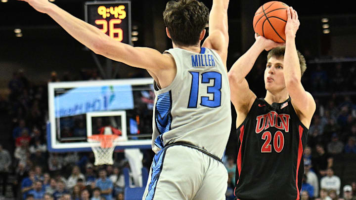UNLV Rebels guard Julian Rishwain (20) attempt a shot against Creighton Bluejays forward Mason Miller (13) in the first half at CHI Health Center Omaha. 
