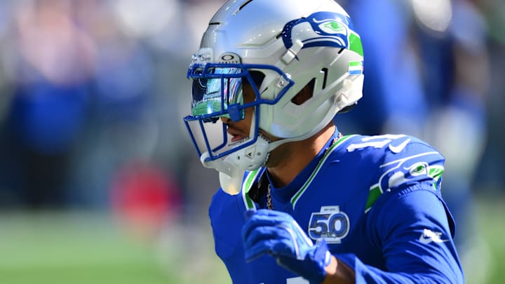 Oct 5, 2025; Seattle, Washington, USA; Seattle Seahawks wide receiver Jaxon Smith-Njigba (11) wearing the Seahawks throw back helmet prior to a game against the Tampa Bay Buccaneers at Lumen Field. 
