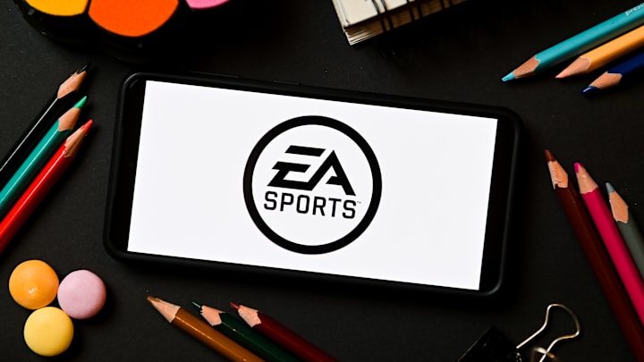 In this photo illustration a EA Sports logo seen displayed...