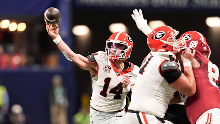 Dec 6, 2025; Atlanta, GA, USA; Georgia Bulldogs quarterback Gunner Stockton (14) throws a pass during the second quarter against the Alabama Crimson Tide during the 2025 SEC Championship game at Mercedes-Benz Stadium. Mandatory Credit: Dale Zanine-Imagn Images