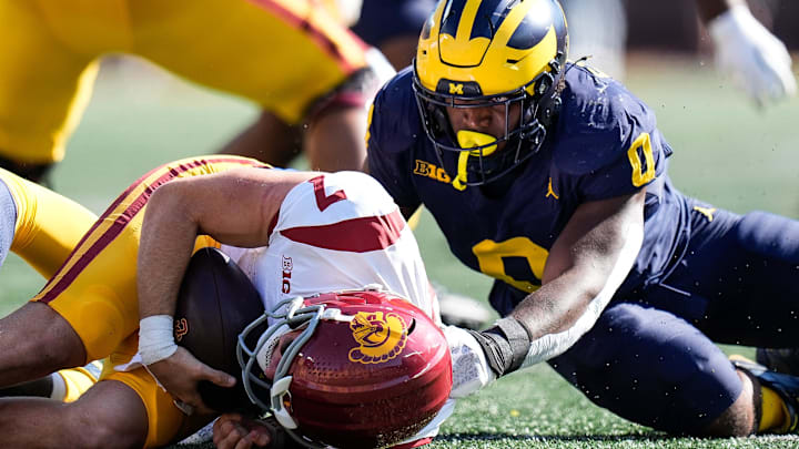 Michigan defensive end Josaiah Stewart (0) sacks USC quarterback Miller Moss (7) during the first half at Michigan Stadium in Ann Arbor on Saturday, Sept. 21, 2024. Michigan defensive end Josaiah Stewart (0) sacks USC quarterback Miller Moss (7) during the first half at Michigan Stadium in Ann Arbor on Saturday, Sept. 21, 2024.