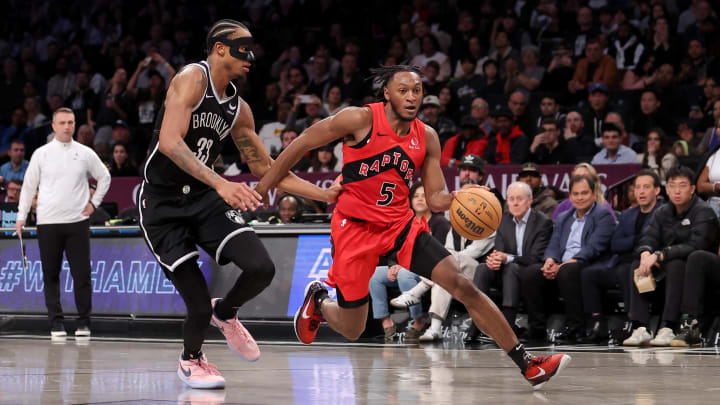 Apr 10, 2024; Brooklyn, New York, USA; Toronto Raptors guard Immanuel Quickley (5) drives to the basket against Brooklyn Nets center Nic Claxton (33) during the fourth quarter at Barclays Center. Mandatory Credit: Brad Penner-USA TODAY Sports Apr 10, 2024; Brooklyn, New York, USA; Toronto Raptors guard Immanuel Quickley (5) drives to the basket against Brooklyn Nets center Nic Claxton (33) during the fourth quarter at Barclays Center. Mandatory Credit: Brad Penner-USA TODAY Sports