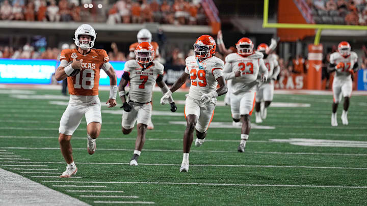 Texas Longhorns quarterback Matthew Caldwell runs for a long gain after keeping the ball during the second half against the Sam Houston Bearkats Texas Longhorns quarterback Matthew Caldwell runs for a long gain after keeping the ball during the second half against the Sam Houston Bearkats