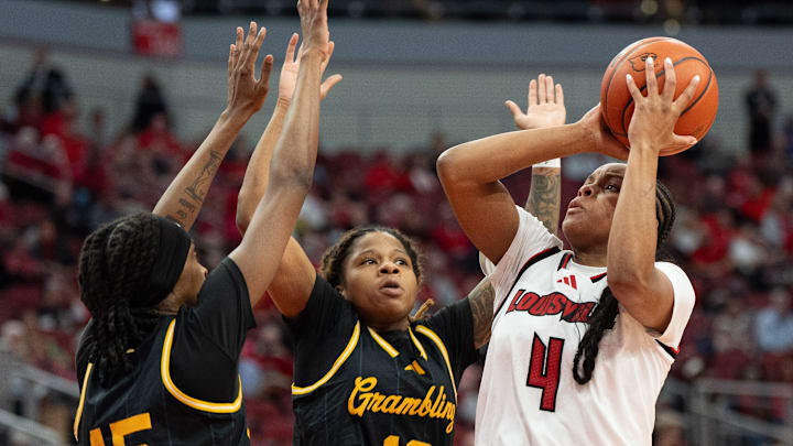 Louisville Cardinals forward Mackenly Randolph (4) goes for a jump shot against Grambling Lady Tigers defenders during their game on Thursday, Dec. 12, 2024 at the KFC Yum! Center in Louisville, Ky.