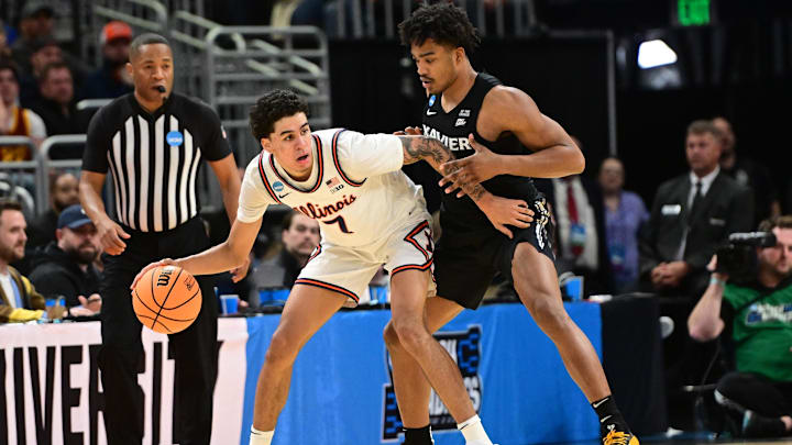 Mar 21, 2025; Milwaukee, WI, USA: Illinois Fighting Illini forward Will Riley (7) drives to the hoop past Xavier Musketeers guard Marcus Foster (1) during the first half at Fiserv Forum. Mandatory Credit: Benny Sieu-Imagn Images