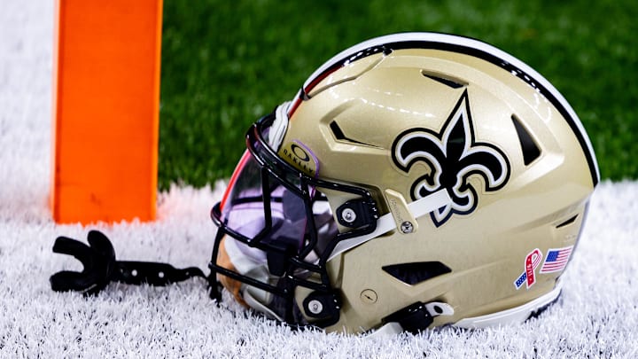 Sep 8, 2024; New Orleans, Louisiana, USA; Detailed view of the New Orleans Saints football helmet before the game against the Carolina Panthers during the pregame at Caesars Superdome. Mandatory Credit: Stephen Lew-Imagn Images Sep 8, 2024; New Orleans, Louisiana, USA; Detailed view of the New Orleans Saints football helmet before the game against the Carolina Panthers during the pregame at Caesars Superdome. Mandatory Credit: Stephen Lew-Imagn Images