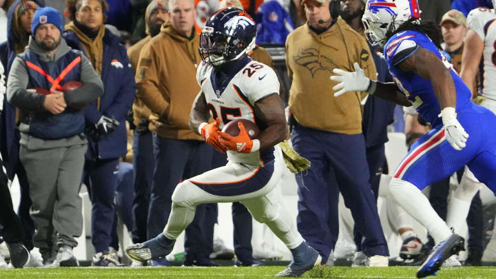 Nov 13, 2023; Orchard Park, New York, USA; Denver Broncos running back Samaje Perine (25) runs with the ball against the Buffalo Bills during the second half at Highmark Stadium. Mandatory Credit: Gregory Fisher-USA TODAY Sports