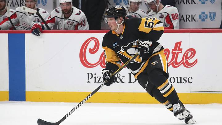 Feb 22, 2025; Pittsburgh, Pennsylvania, USA;  Pittsburgh Penguins center Philip Tomasino (53) moves the puck against the Washington Capitals during the second period at PPG Paints Arena. Mandatory Credit: Charles LeClaire-Imagn Images