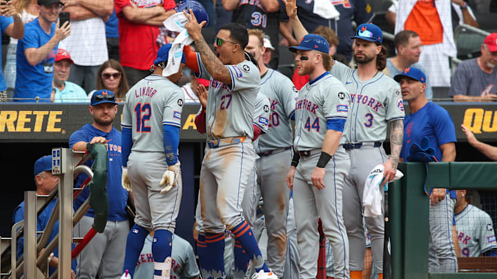 Sep 30, 2024; Atlanta, Georgia, USA; New York Mets shortstop Francisco Lindor (12) celebrates after a two-run home run with third baseman Mark Vientos (27) against the Atlanta Braves in the ninth inning at Truist Park. Mandatory Credit: Brett Davis-Imagn Images