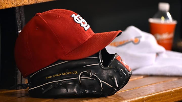 Aug 15, 2015; St. Louis, MO, USA; A detailed view of a baseball glove and St. Louis Cardinals hat in the dugout during the game between the Cardinals and the Miami Marlins at Busch Stadium. Mandatory Credit: Jasen Vinlove-Imagn Images Aug 15, 2015; St. Louis, MO, USA; A detailed view of a baseball glove and St. Louis Cardinals hat in the dugout during the game between the Cardinals and the Miami Marlins at Busch Stadium. Mandatory Credit: Jasen Vinlove-Imagn Images