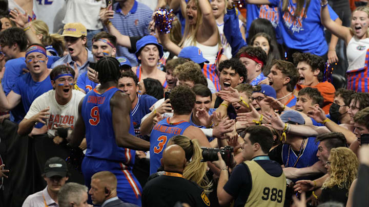 Apr 5, 2025; San Antonio, TX, USA; Florida Gators center Rueben Chinyelu (9) and center Micah Handlogten (3) react with the crowd after defeating the Auburn Tigers in the semifinals of the men's Final Four of the 2025 NCAA Tournament at Alamodome. Mandatory Credit: Scott Wachter-Imagn Images