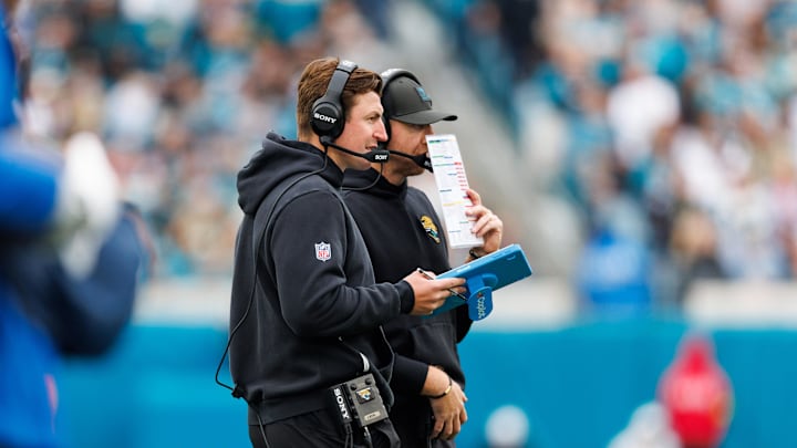 Jan 4, 2026; Jacksonville, Florida, USA; Jacksonville Jaguars offensive coordinator Grant Udinski and head coach Liam Coen during the second quarter against the Tennessee Titans at EverBank Stadium. Mandatory Credit: Morgan Tencza-Imagn Images